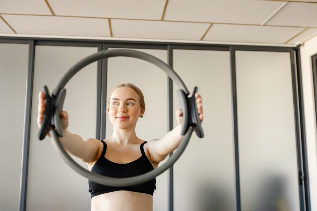 Portrait of a woman doing excercises with a special equipment